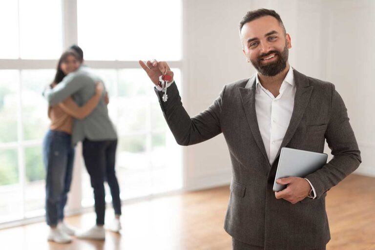 A home inspector examines a home's exterior with a clipboard while a resident watches nearby.